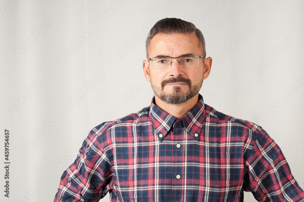 Portrait of senior man in eyeglasses on gray background Portrait of senior man in eyeglasses on gray background