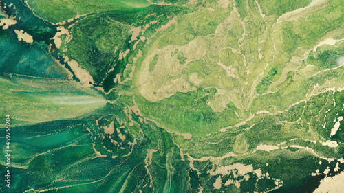 Impressive Green, Golden Ink Blends Together. Emerald Gold Ink Turbulent Spills. Ink Foto. Abstract Gold Glitter Particles Rise to Surface Green Tide Paint Splatter Spreading of Center to Left Side