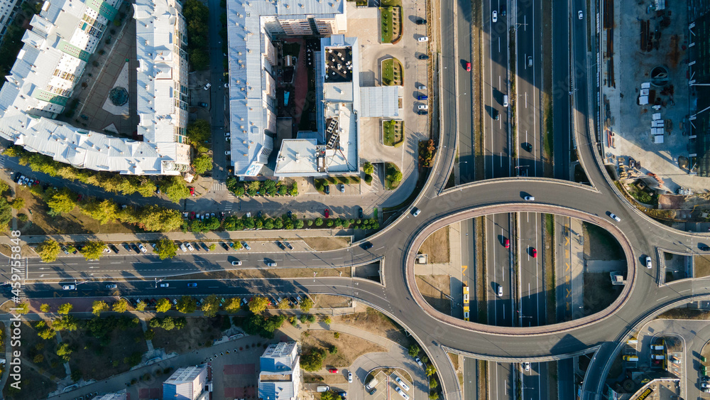 Aerial view of highway and overpass in city on a sunny day. Drone view of massive highway intersection in Belgrade, Serbia.