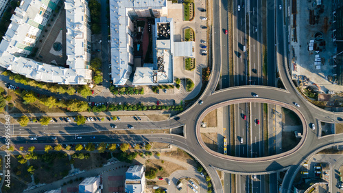 Aerial view of highway and overpass in city on a sunny day. Drone view of massive highway intersection in Belgrade, Serbia.