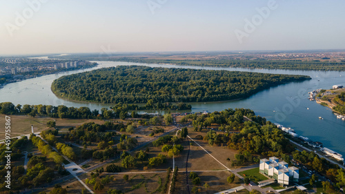 Aerial view of Large war island at the estuary of Sava river into the Danube river before sunset, Belgrade Serbia.