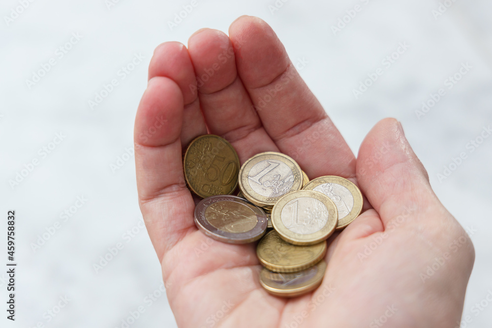 Pile of coins in hand. Saving money concept Pile of coins in hand. Saving money concept