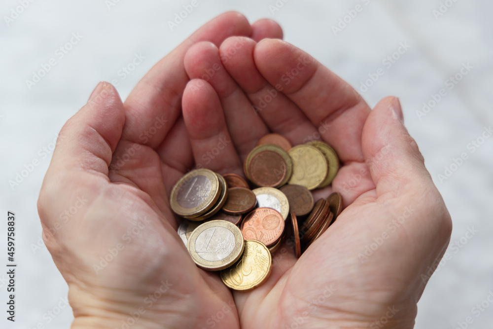 Pile of coins in hands. Saving money concept Pile of coins in hands. Saving money concept