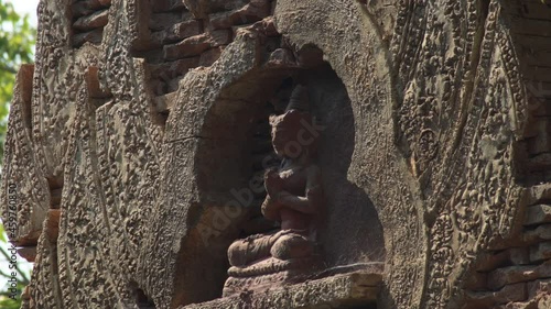 Religious figure praying in a archaeological temple asiatic monument photo