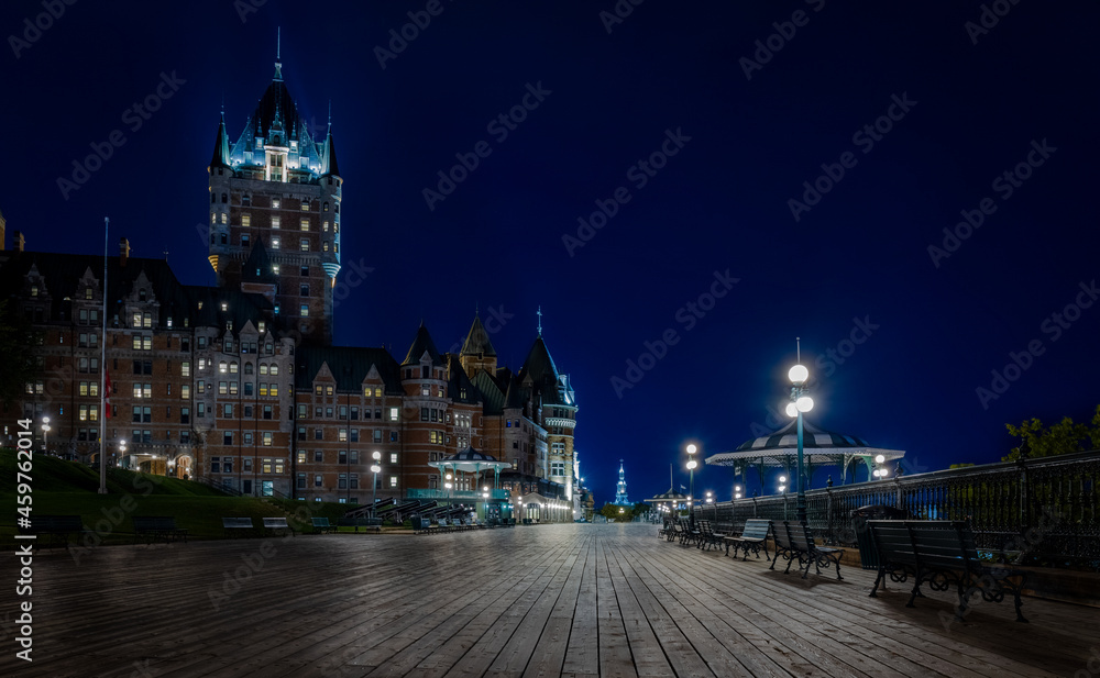 night view of Quebec City's Chateau Frontenac and its boardwalk.