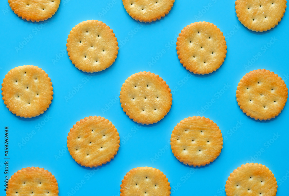 crackers or biscuits arrange on blue background isolated.