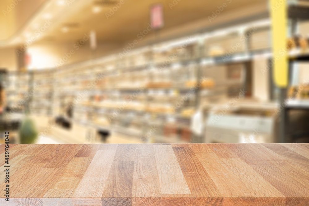 Table top with abstract blur beautiful luxury shelf food store in the shopping mall and blurred light interior background with bokeh department store, Ready for product montage.