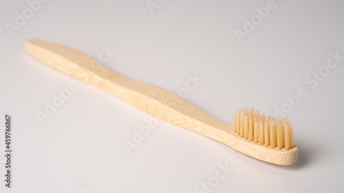 Eco dental concept. Natural bamboo toothbrush. Wooden toothbrush on white background with copy space