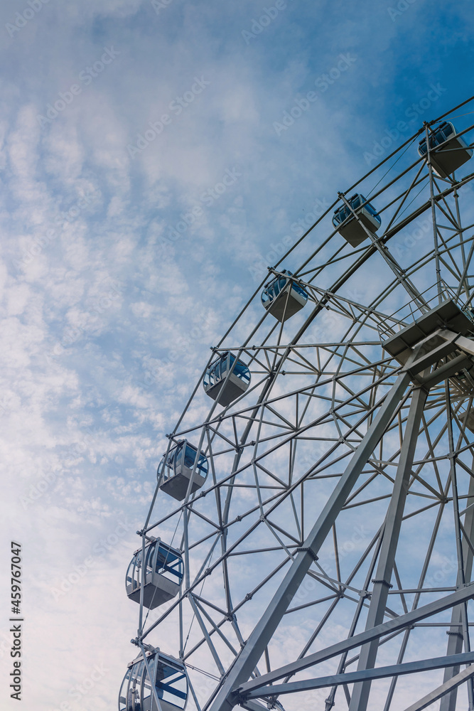 ferris wheel over the blue sky