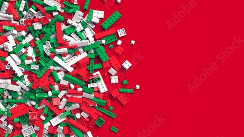Toy bricks in traditional christmas colors. Pile of red green and white toy bricks on red background with place for your text. Educational toy for children. 3d rendering