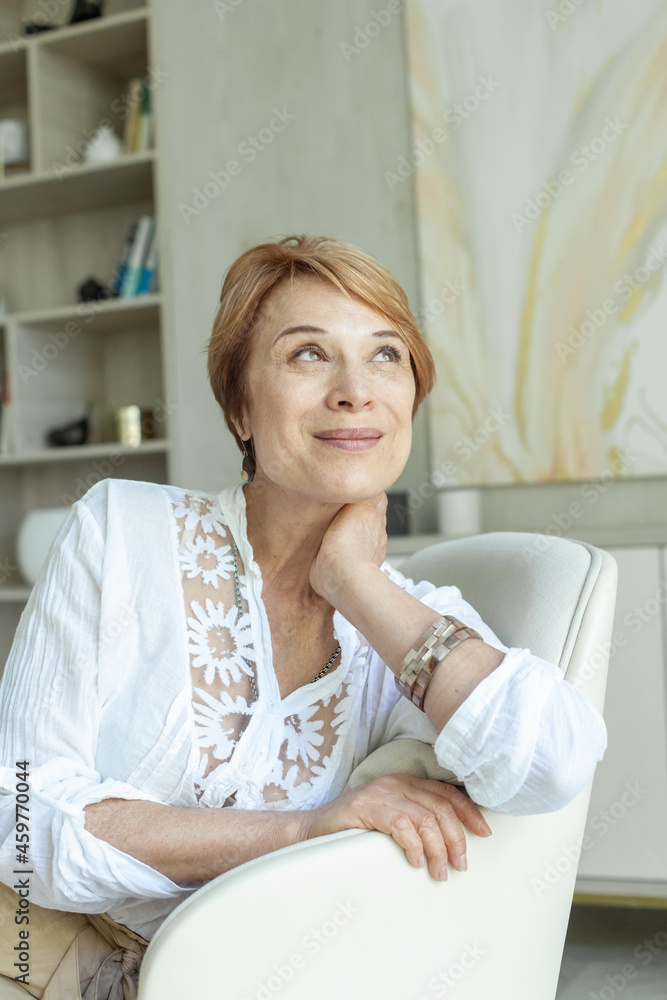 Attractive mature senior woman resting at home Attractive mature senior woman resting at home