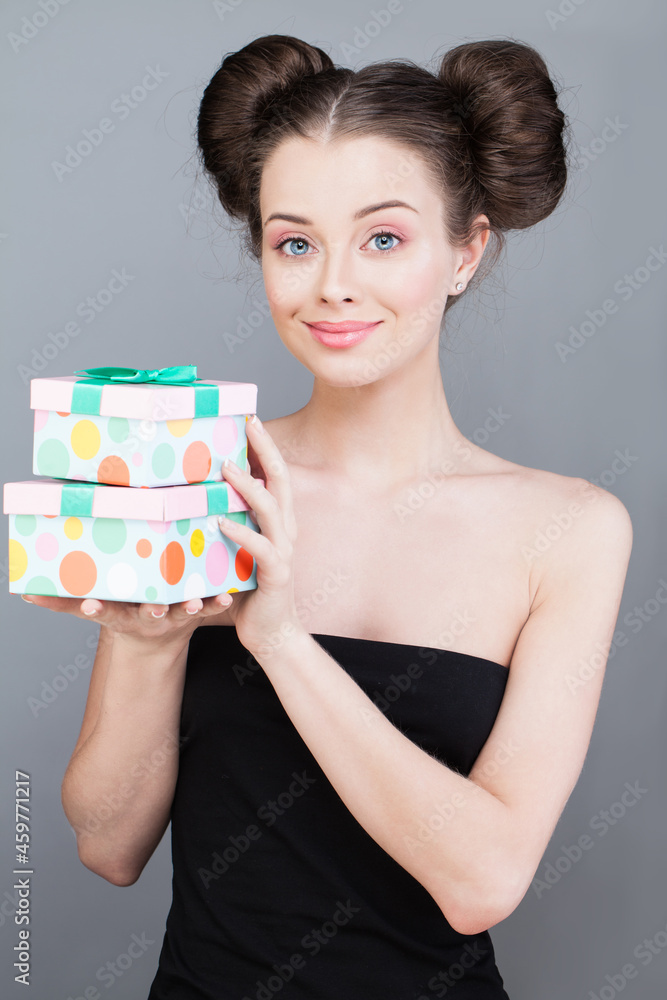 Nice attractive lovely gorgeous excited cheerful woman enjoying present box gift on grey background Nice attractive lovely gorgeous excited cheerful woman enjoying present box gift on grey background