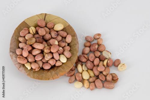 Selective focused Indian health snack roasted peanuts with salt on an isolated white background. Roasted without oil and very healthy daily snacks, Tamilnadu, Mumbai, Delhi, Kerala. photo