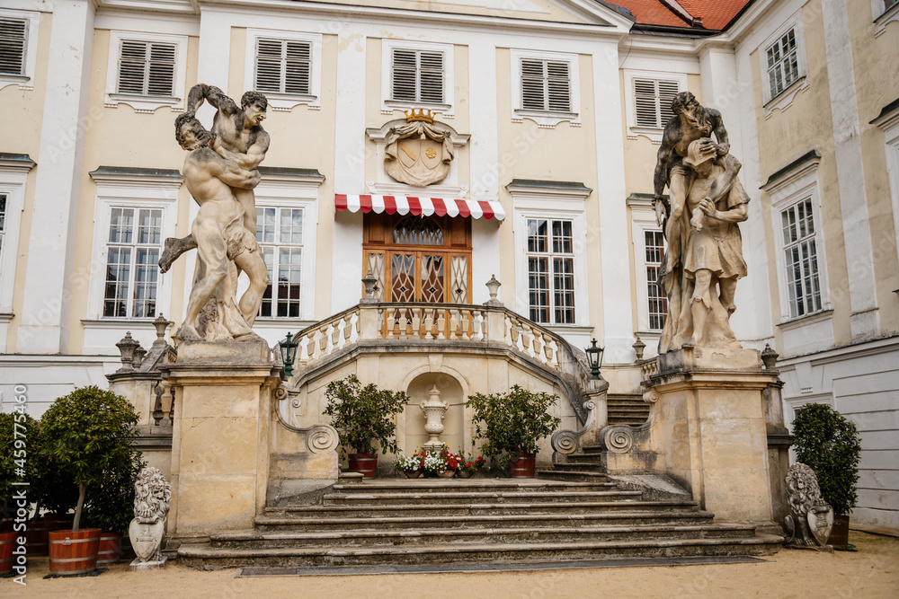 Vranov nad dyji, Southern Moravia, Czech Republic, 03 July 2021: entrance to baroque and gothic medieval castle on hill at sunny summer day, courtyard with antique statues, stairs next to fountain