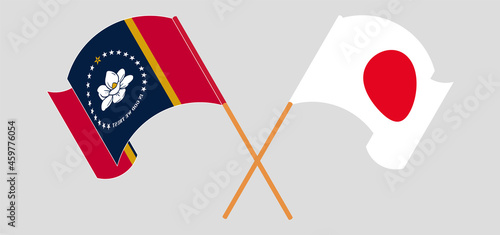 Crossed and waving flags of The State of Mississippi and Japan