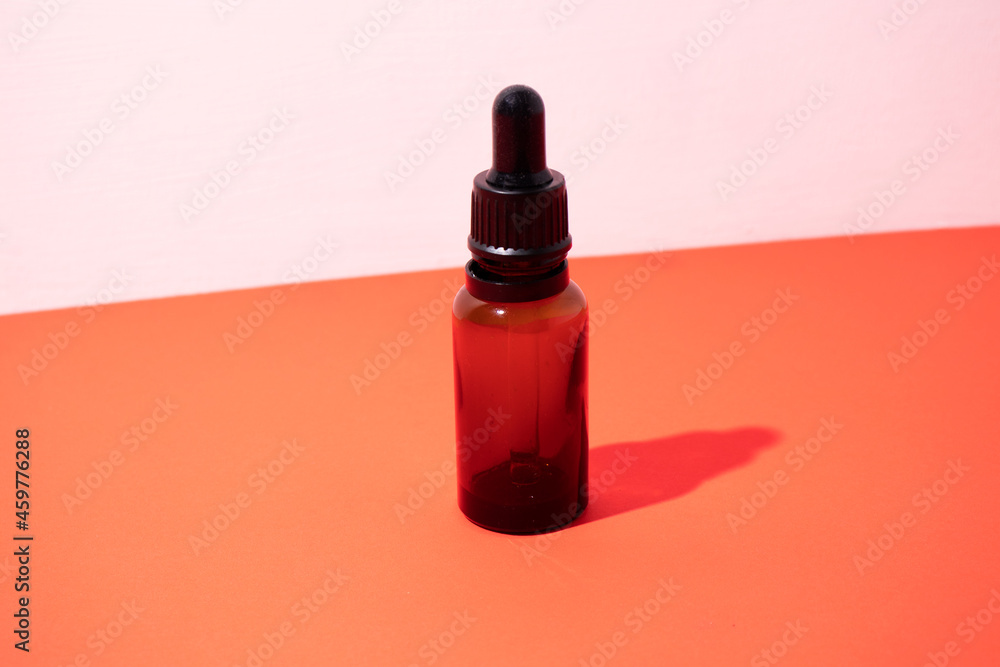 Serum bottle. Empty yellow glass essential oil bottle. Organic Spa Cosmetics. Serum bottle. Empty yellow glass essential oil bottle. Organic Spa Cosmetics.