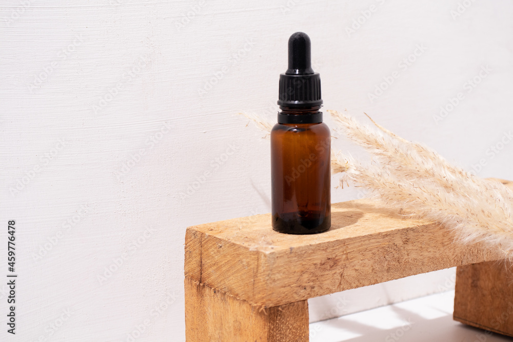 Serum bottle. Empty yellow glass essential oil bottle. Organic Spa Cosmetics. Serum bottle. Empty yellow glass essential oil bottle. Organic Spa Cosmetics.