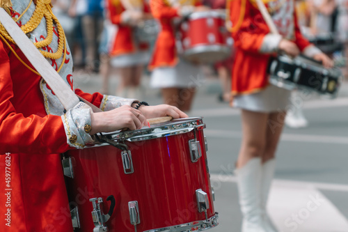 Young girls drummer at the parade. Street performance. Majorettes in the parade