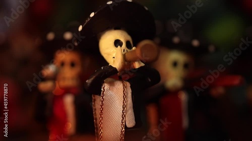 placing mariachi figure in traditional mexican offering to celebrate Day of the Dead in Mexico photo