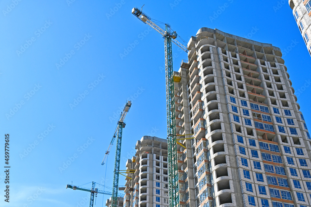 Crane and highrise construction site Crane and highrise construction site