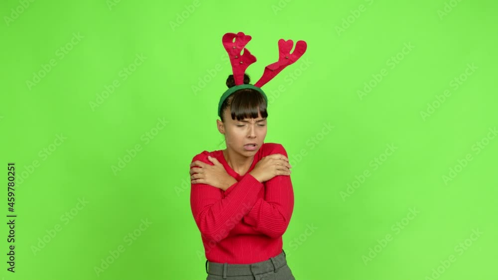 Young woman wearing christmas hat with sore throat over isolated background. Green screen chroma key Young woman wearing christmas hat with sore throat over isolated background. Green screen chroma key