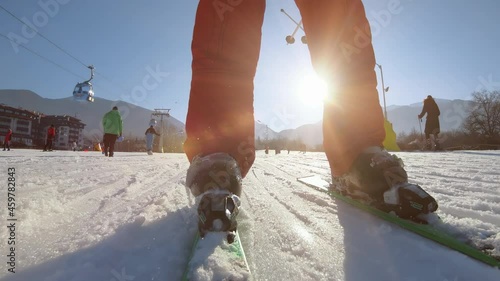 Bansko, Bulgaria - 12 Feb, 2021: Skier on go down the ski track along gondola ski lift