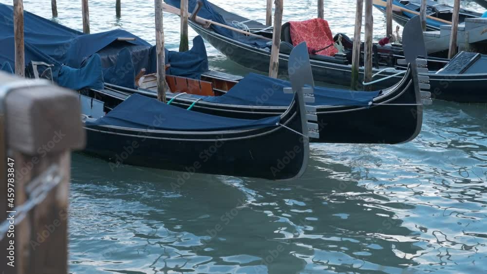 Gondolas on the water in Venice on a calm afternoon Gondolas on the water in Venice on a calm afternoon