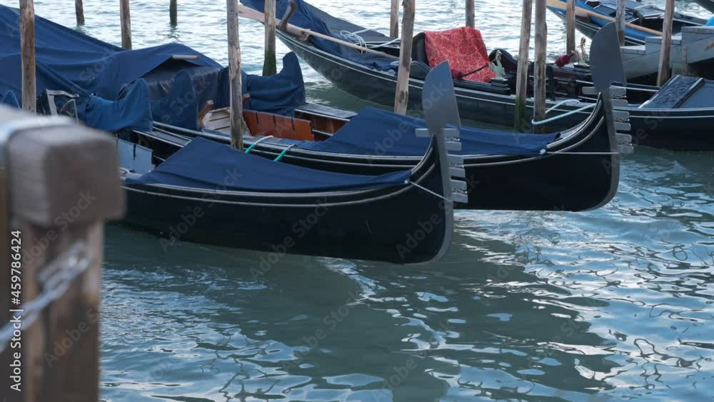 Gondolas on the water in Venice on a calm afternoon Gondolas on the water in Venice on a calm afternoon