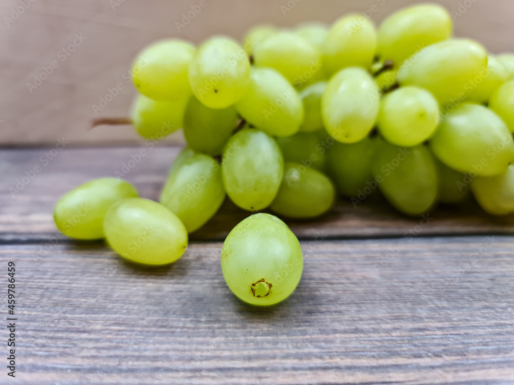 The Natural fresh green grapes close-up. Bunch of grapes. The Natural fresh green grapes close-up. Bunch of grapes.