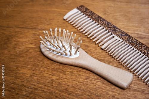 Wooden hair combs lie on the table