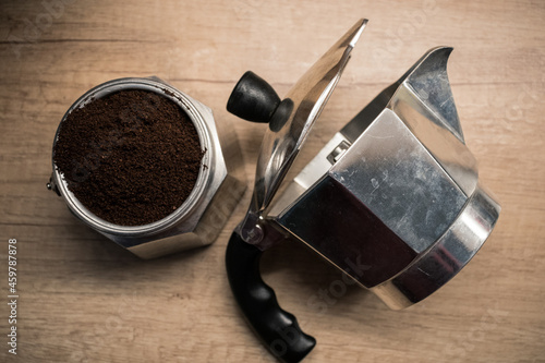 Caffettiera filled with coffee in a kitchen with nice lighting from above