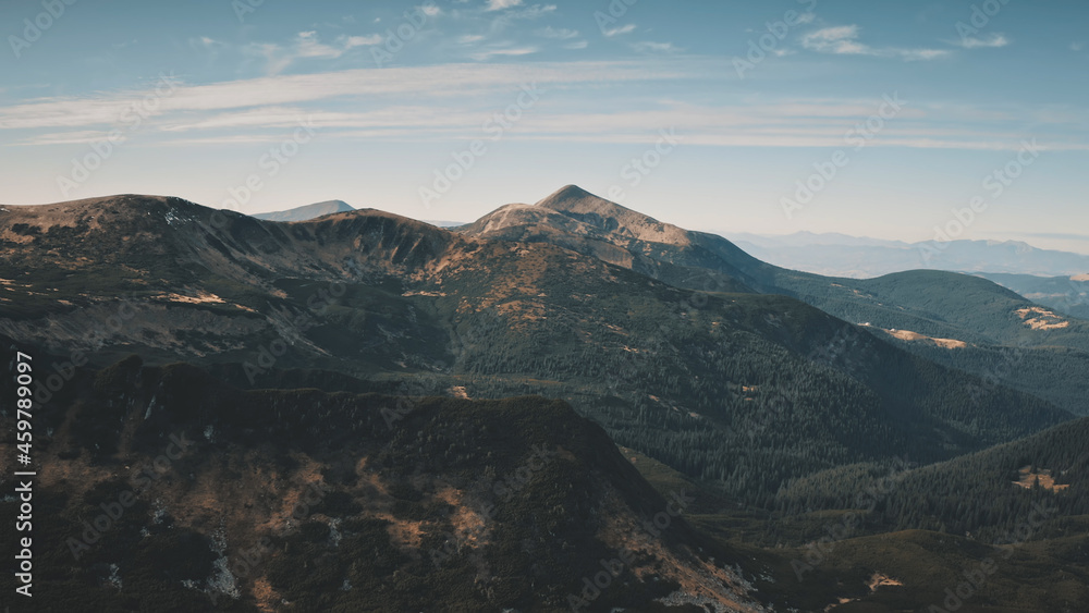 Autumn mountain ranges aerial. Nobody nature landscape. Green pine trees forets on hills, peaks. Greenery grass valley. Travel to Carpathians mount ridges , Ukraine, Europe. Cinematic drone shot