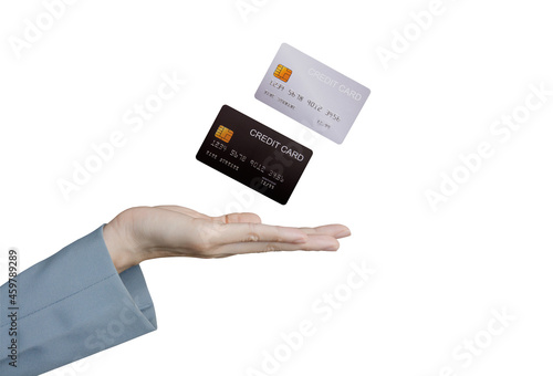Credit card floating in the hand of a business woman on white background.	