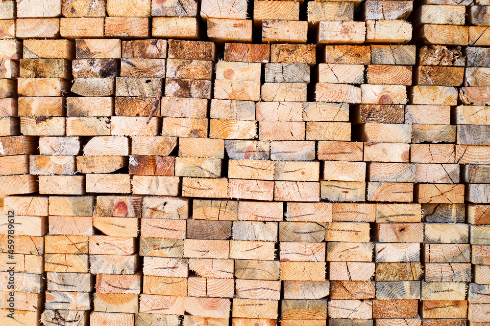 Background from wooden boards close-up. The surface of the end of the board. Stacked timber, lumber, woodworking Background from wooden boards close-up. The surface of the end of the board. Stacked timber, lumber, woodworking
