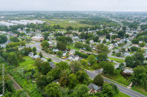Panorama view over the small town landscape suburb homes sleeping area roof houses in Woodbridge NJ near oil refinery industrial tank