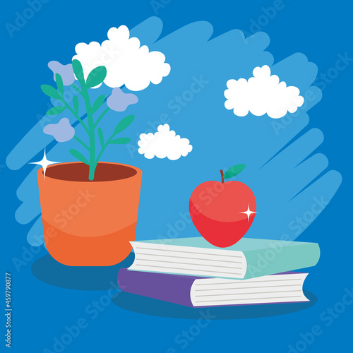 plant and apple on books