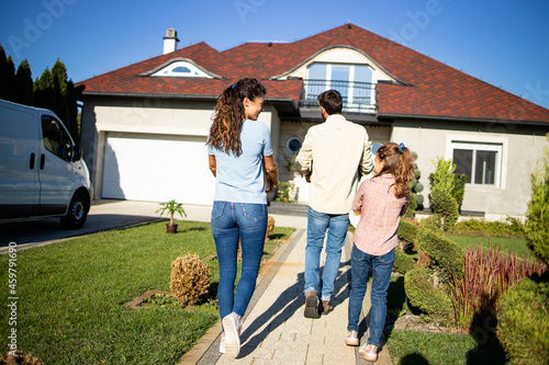 фотографія Happy family just bought a new house and moving in.