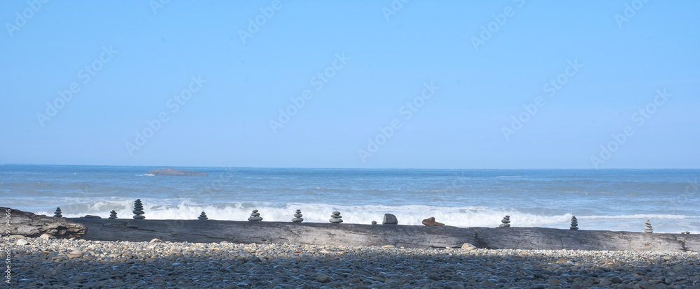 Ruby Beach, WA - USA - Sept. 21, 2021: Horizontal view of cairns, piled up rocks, or stone johnnies along the scenic Ruby Beach, the coastal section of Olympic National Park.