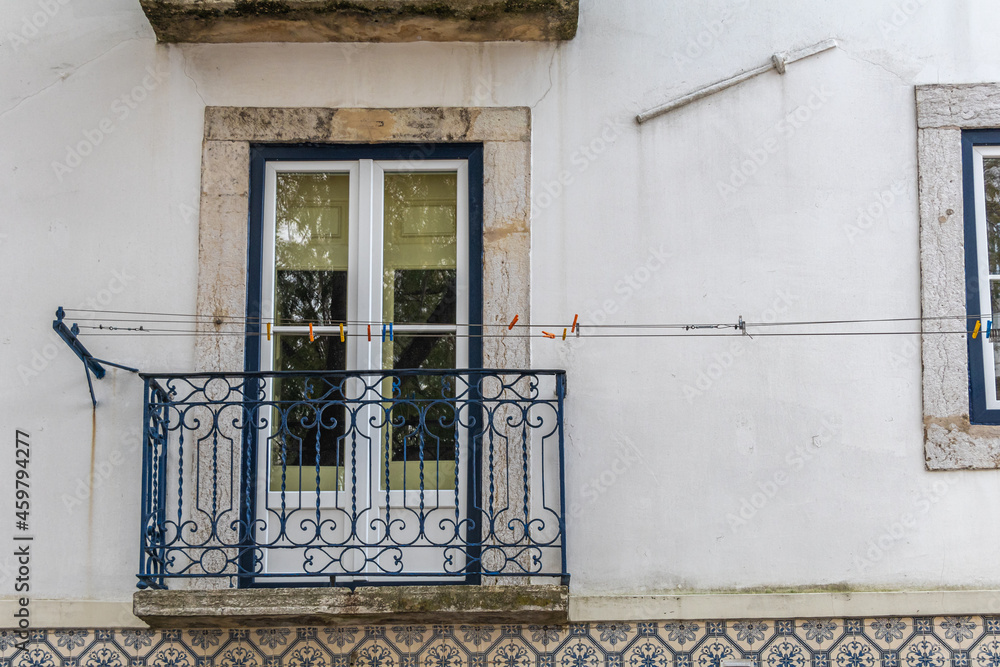 Obraz premium Traditional residential facade with a small balcony