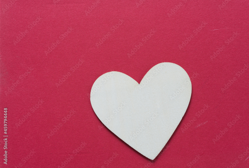 wooden heart on a red background