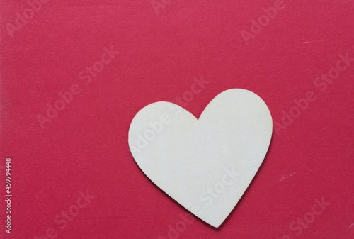wooden heart on a red background