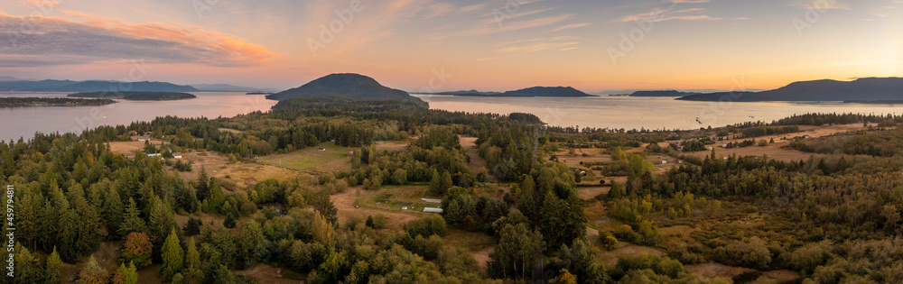 Panoramic Aerial Sunset View of Lummi Island, Washington. Looking south in the Salish Sea with Bellingham Bay on the left and Orcas Island on the right.