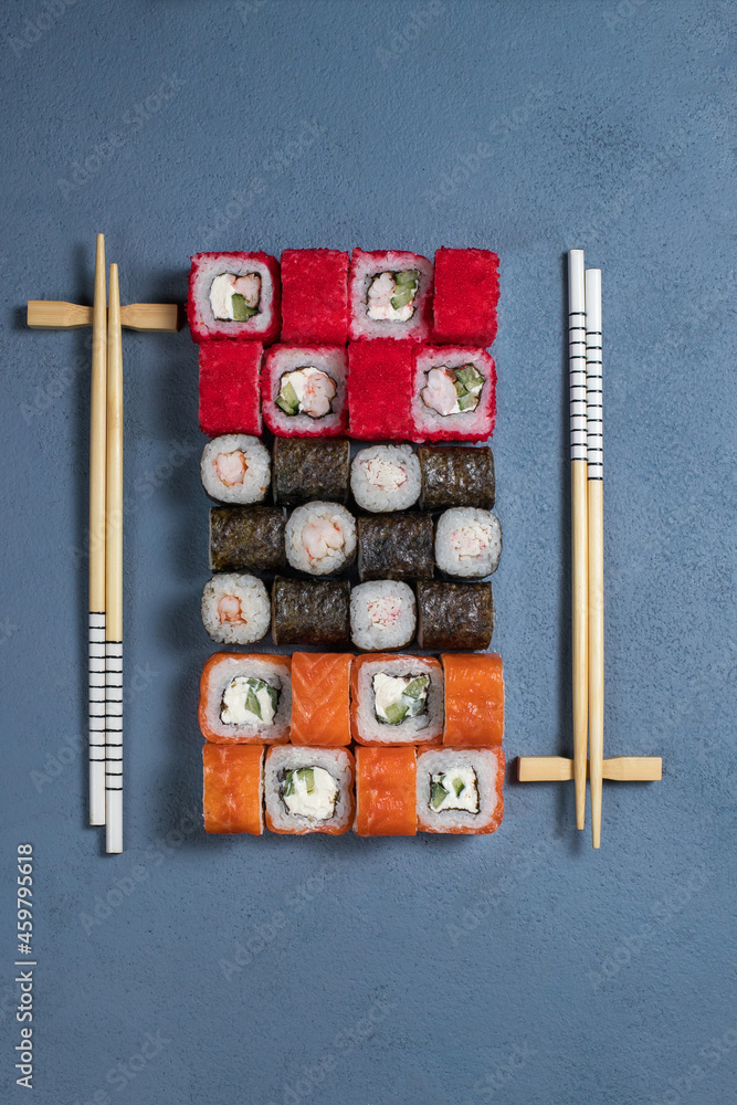 Sushi Set nigiri and sushi rolls on gray stone slate on metal background Sushi Set nigiri and sushi rolls on gray stone slate on metal background
