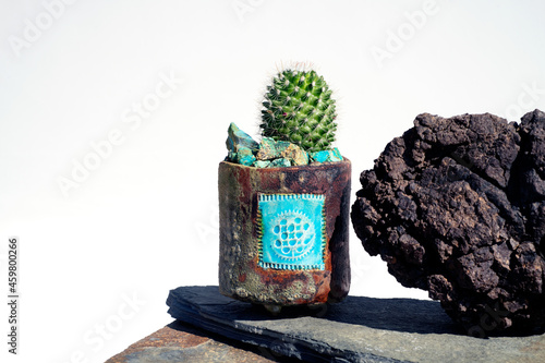 Cactus with lava stone and Chrysocolla blue rocks.  photo