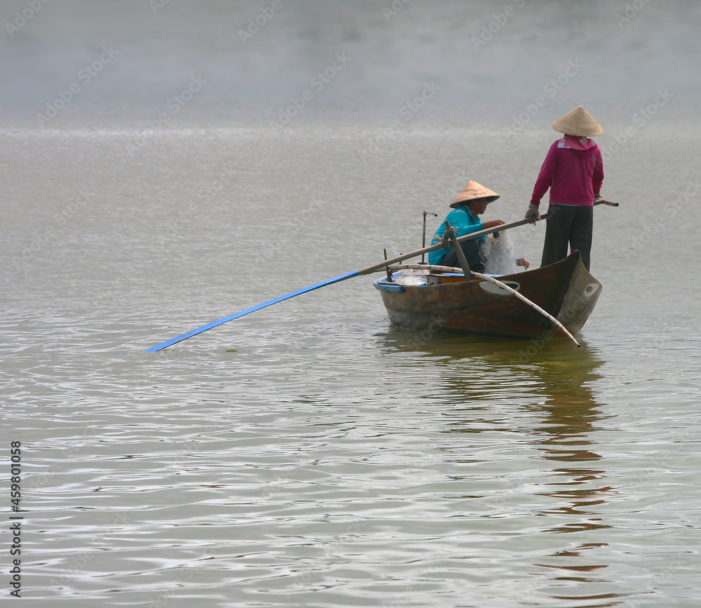 Fishing boat on calm water in Vietnam