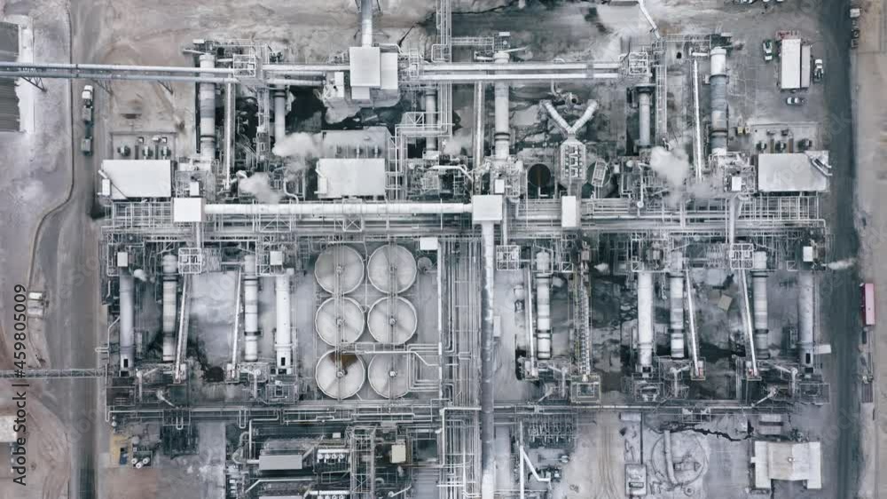 Top down aerial 4K view on industrial manufacture plant. Chemical air pollution, global warming disaster, greenhouse effect. California industrial city view, United States of America dangerous refuse Top down aerial 4K view on industrial manufacture plant. Chemical air pollution, global warming disaster, greenhouse effect. California industrial city view, United States of America dangerous refuse