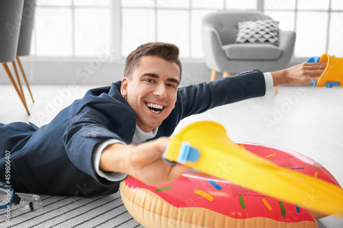 Happy man with paddles and ...