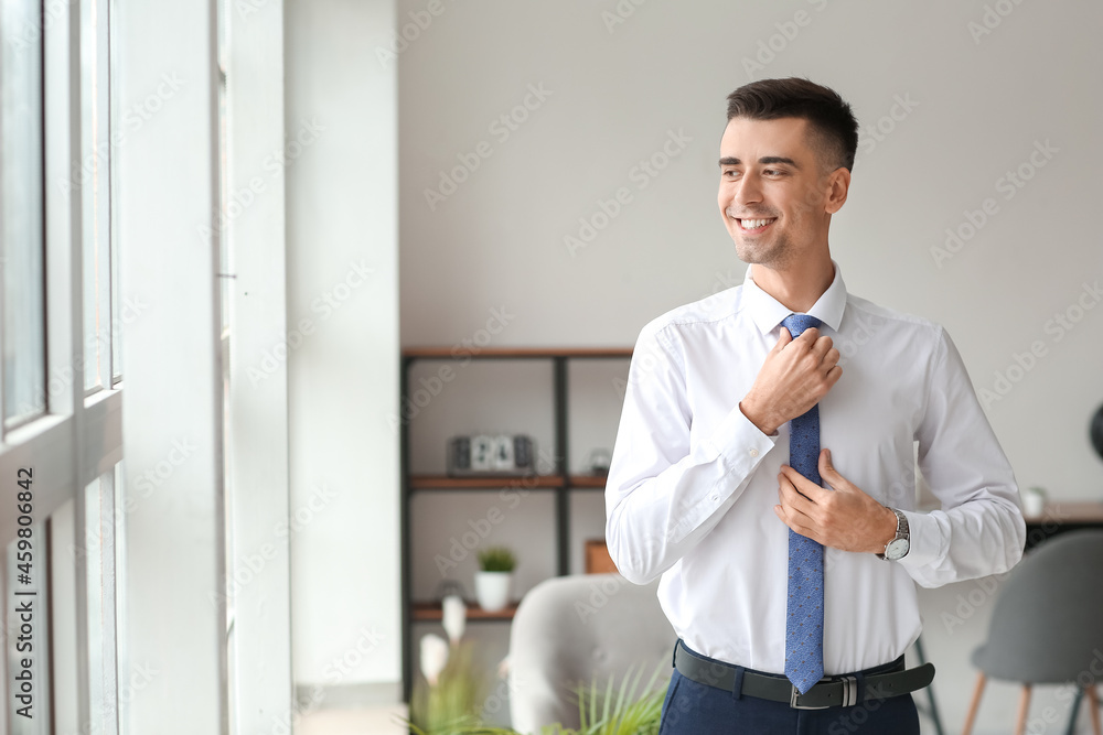 Handsome young man in stylish suit at home Handsome young man in stylish suit at home