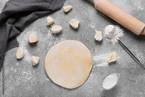 Fresh rolled dough on dark background