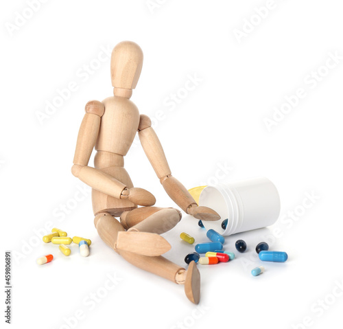 Wooden mannequin with pills...